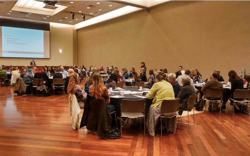 Library staff at round tables during a CLiC workshop